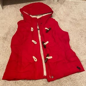 Red fleece lined puffer vest with toggle buttons